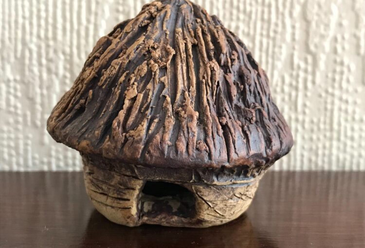 Photo of miniature clay crannog made by Sioned, a visitor at the centre.